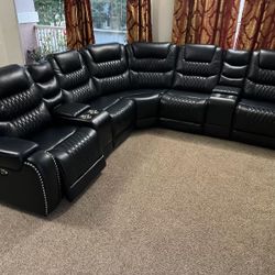 New Reclining Sectional .  Ink Blue Gel Leatherette .  122” X 122”.  Free Delivery !