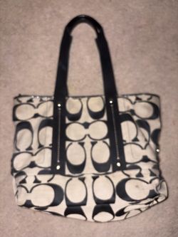 Coach black/tan tote bag with repeating c logo