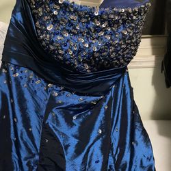 Fairytale gown, Saphire Blue, And It Doesn’t Have A Size But My Guess Is 