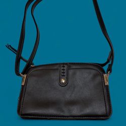 black leather crossbody bag with an adjustable strap