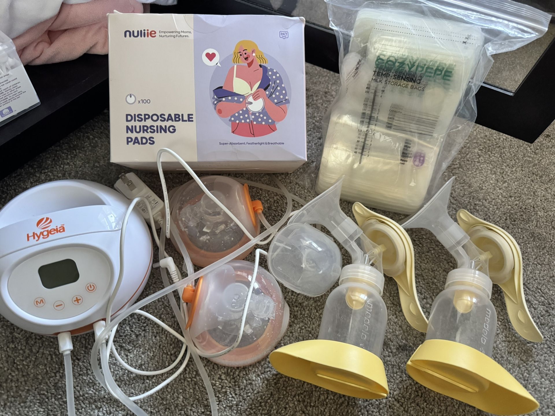 Hygeia Wearable Pump,2Medela Hand Pumps,2unused NippleSheilds, Storage Bags,Pads&Cream
