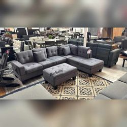 sectional sofa with drop-down armrest cupholder, and storage ottoman