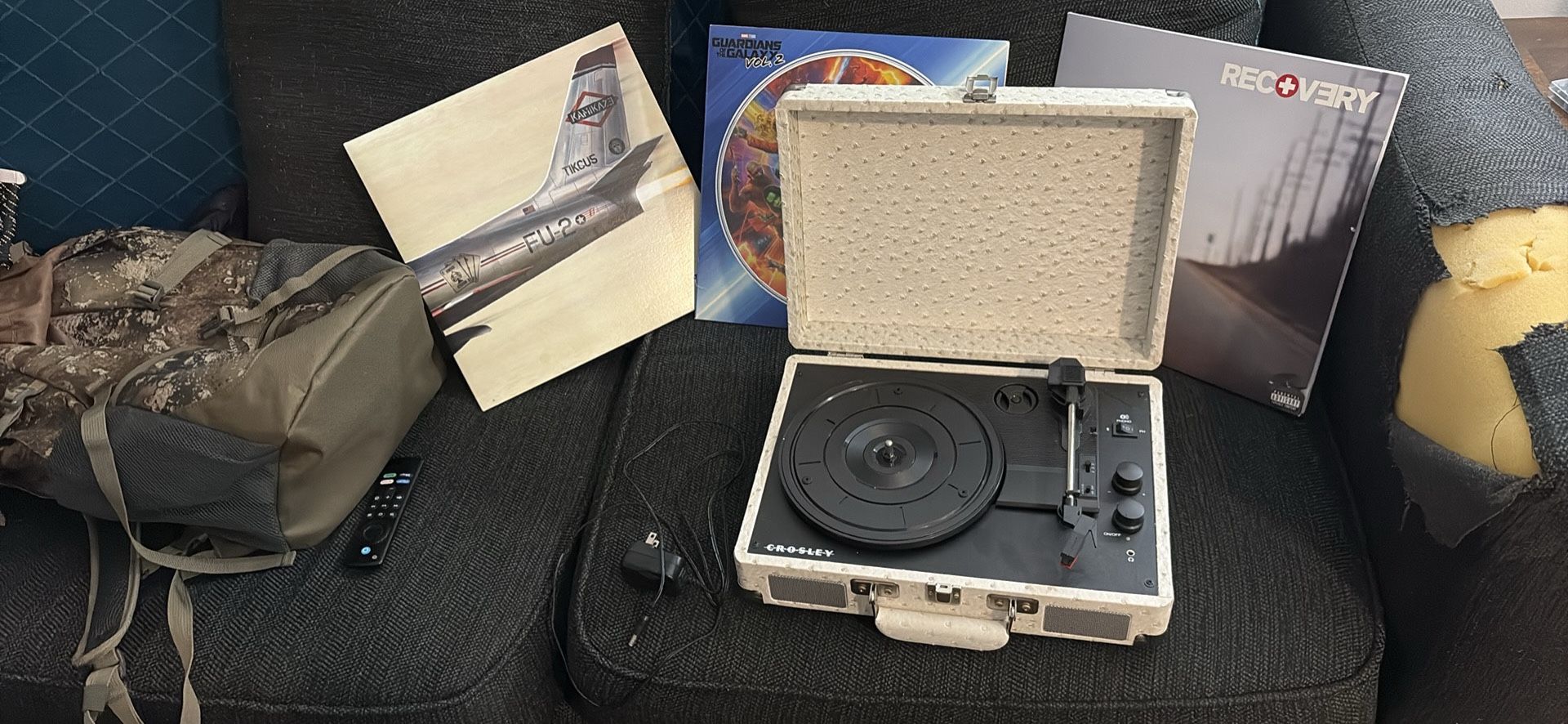 vinyl player with 3 records