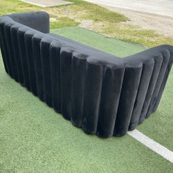 Black velvet sofa