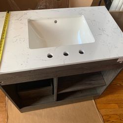 Bathroom Vanity With A Marble Print Countertop

