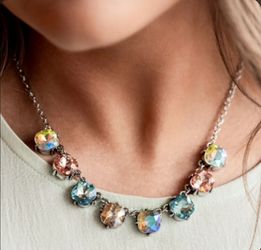 Brand new beautiful necklace and earrings set.  (Never used ) still sealed in package never open)