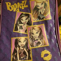 Bratz tote suitcase, zipper works, toggle and bars on back have rust. Handle collapses, has wheels, good for storage, bug out bag. East, west or north