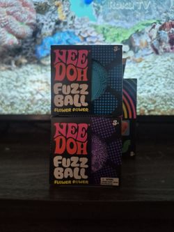 Two NeeDoh Fuzzballs Blue and Purple