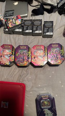 Pokemon tins with packs inside