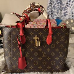 Louis Vuitton brown monogram tote with red handles
