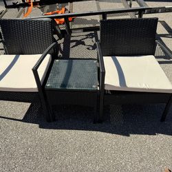 3 Piece Wicker Patio Set With Cushions, Table With Glass Top  Chairs  23 3/4” wide  21” deep  16” floor to seat  28 1/2” tall in back  Table  15 1/2”