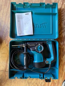 Brand new Makita corded rotary hammer drill in case