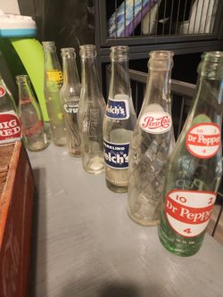 Collector coke bottles and Coca Cola wood bottle crate