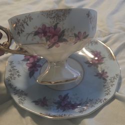 vintage Royal Sealy teacup and saucer set with a floral pattern and gold trim. 