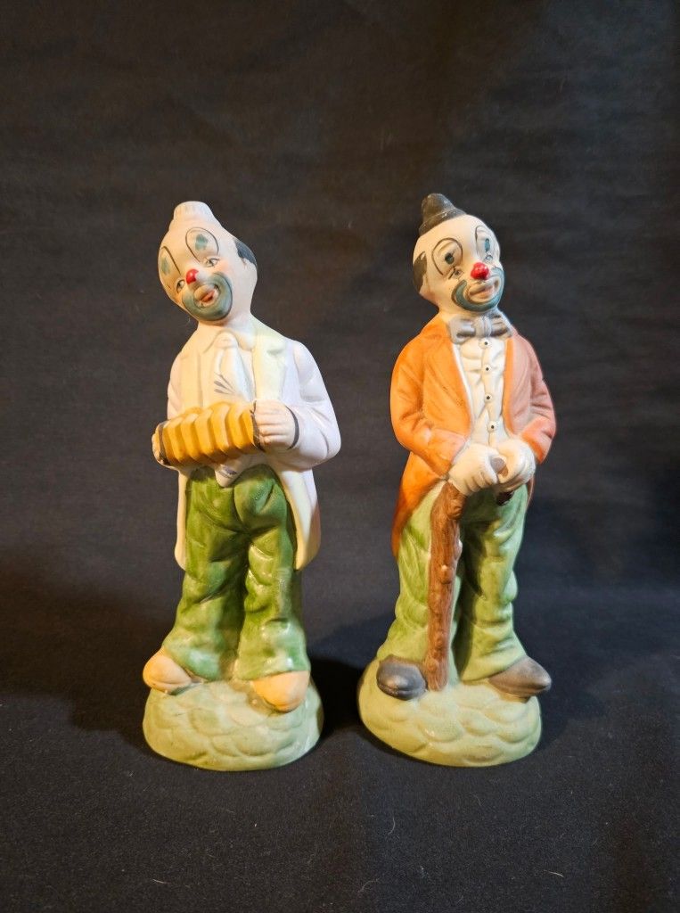 Ceramic Hobo Tramp Clown Figurines Walking Cane Accordion 8" Tall This product is a set of two 8" tall ceramic hobo tramp clown figurines, each holdin