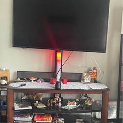 TV STAND W/ TV MOUNT BUILT IN, 3 black glass shelves (nothing 4 sale just tv stand)see pics $125 OBO HOLDS 55inch now