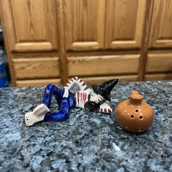 Vintage Sleeping Hillbilly with Jug Pair of Salt and Pepper Shakers.  Preowned missing 1 stopper.  Has been on display in a cabinet with a very large 