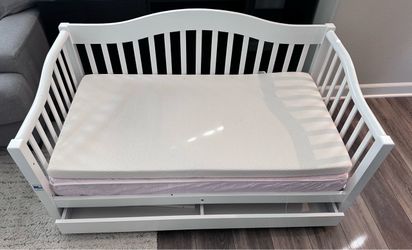 Toddler bed with mattress.