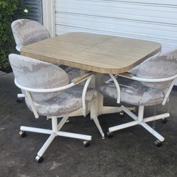 Retro Dining Table Set with 4 Rolling Chairs + 2 Leaf Extensions
