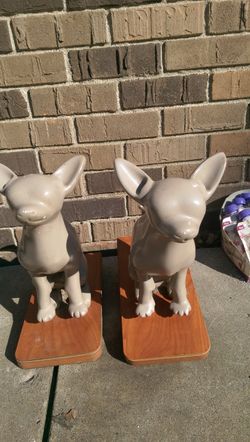 . Two little plastic Chihuahuas on stands