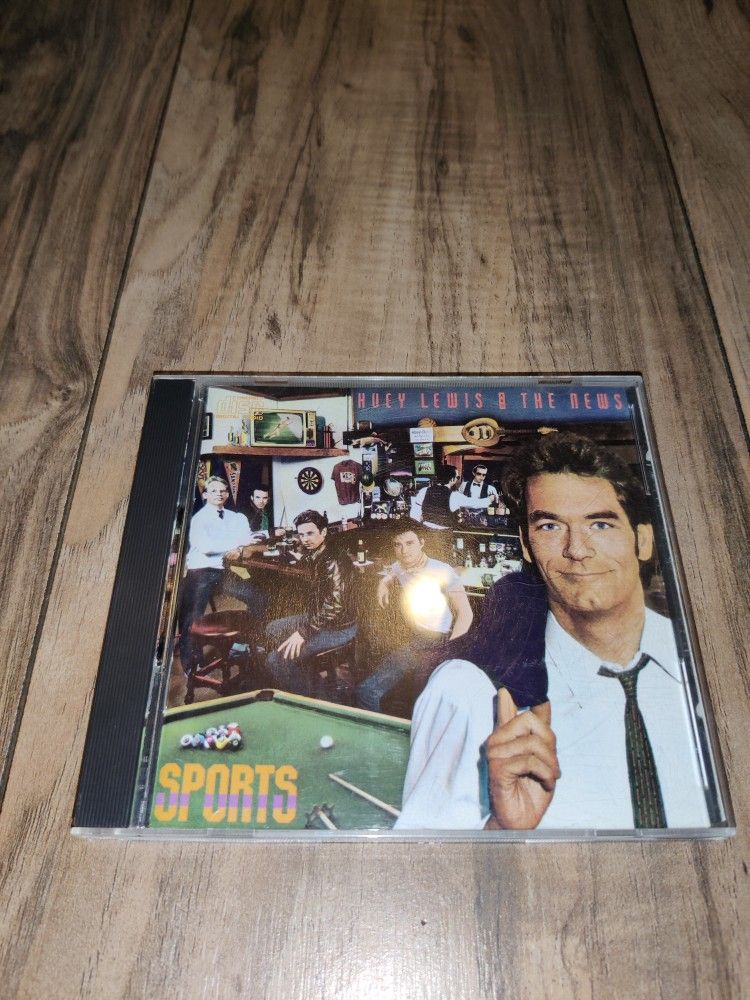 Sports by Huey Lewis And The News (1984 CD Chrysalis). Has some wear from age and use. Sold as is.