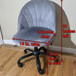 Gray chair swivels rolls