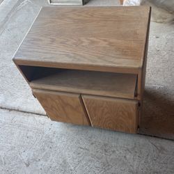TV stand on rollers and pull out shelf