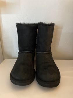 Black UGG boots with bow detail