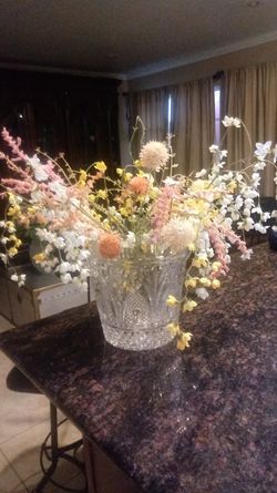 Crystal vase with flowers.