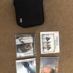 4 CDs Plus Cd Holder With About 10 CDs 
