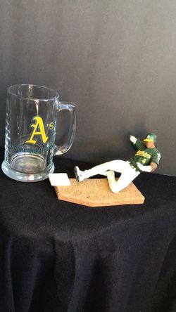 Vintage collectible athletics drink mug and figure