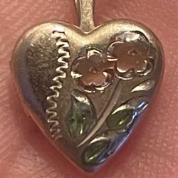 Vintage 14 karat gold build mini locket