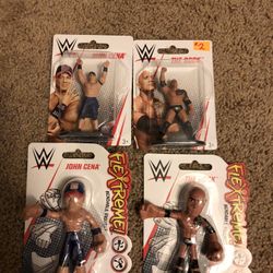 Four different wrestling figures