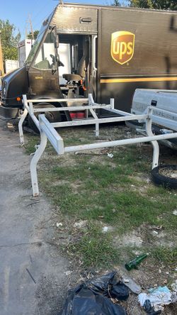 Service body ladder, pipe rack