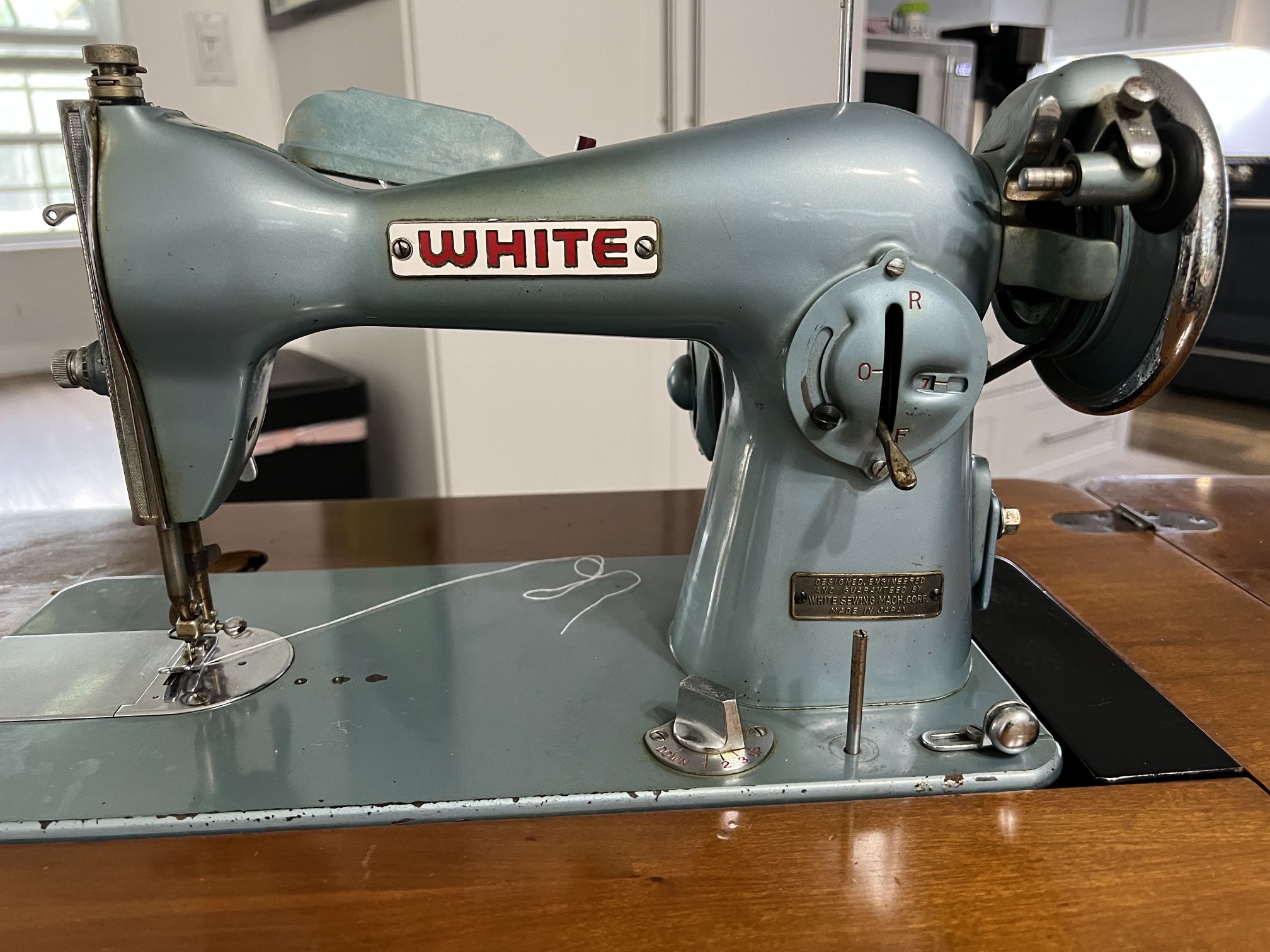 White Sewing Machine In Cabinet With Stool