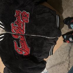 Full length woman’s true religion zip up, Size small, black red nd white.