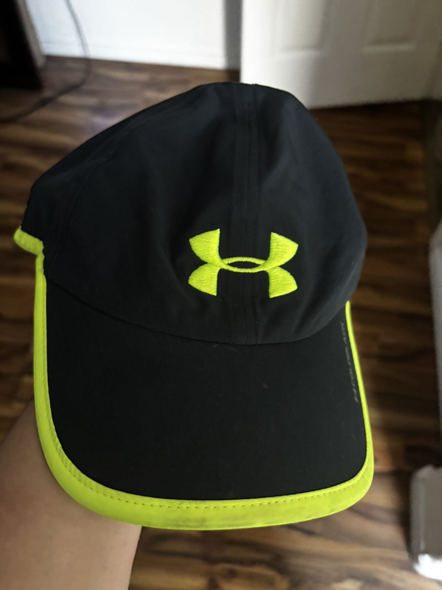 Under Armour brand women’s black With neon yellow snap on adjustable hat