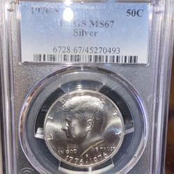 1976 SPCGSMS 67 50 Cent silver