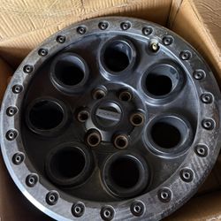 Authentic black beadlock-style off-road wheels