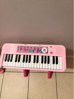 Pink piano and mini doll house