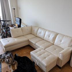 White Faux Leather Sectional And Ottomon
