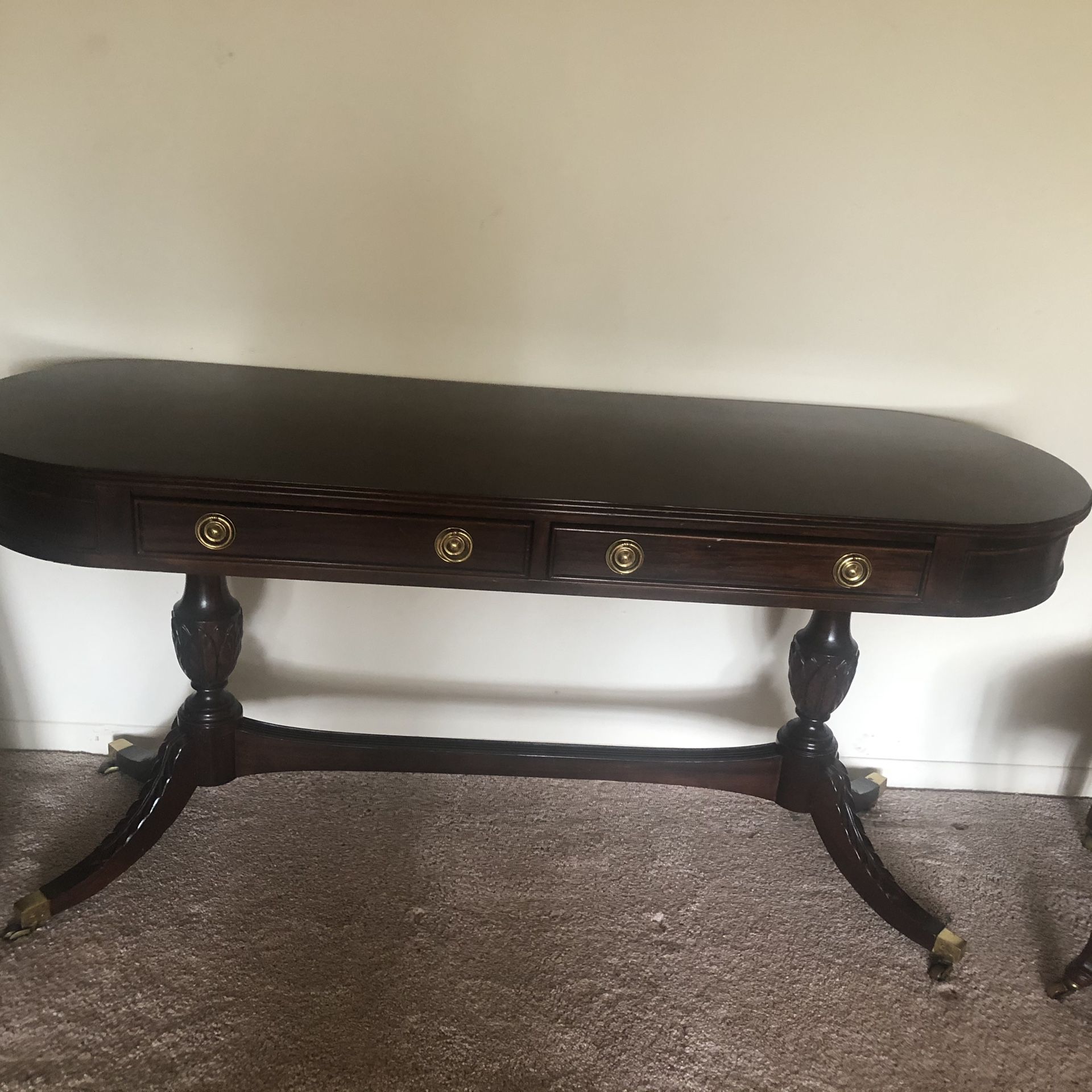 Century dark carved wood long table/ desk on wheels