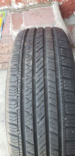1 used tire ...una llanta usada