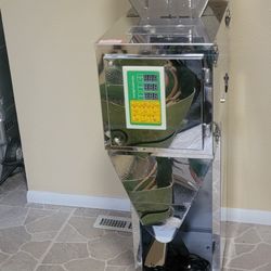 intelligent packaging machine, which is used for automatically weighing and filling materials