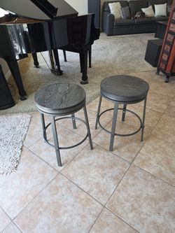 Two brand new swivel stools. 24 inches tall.