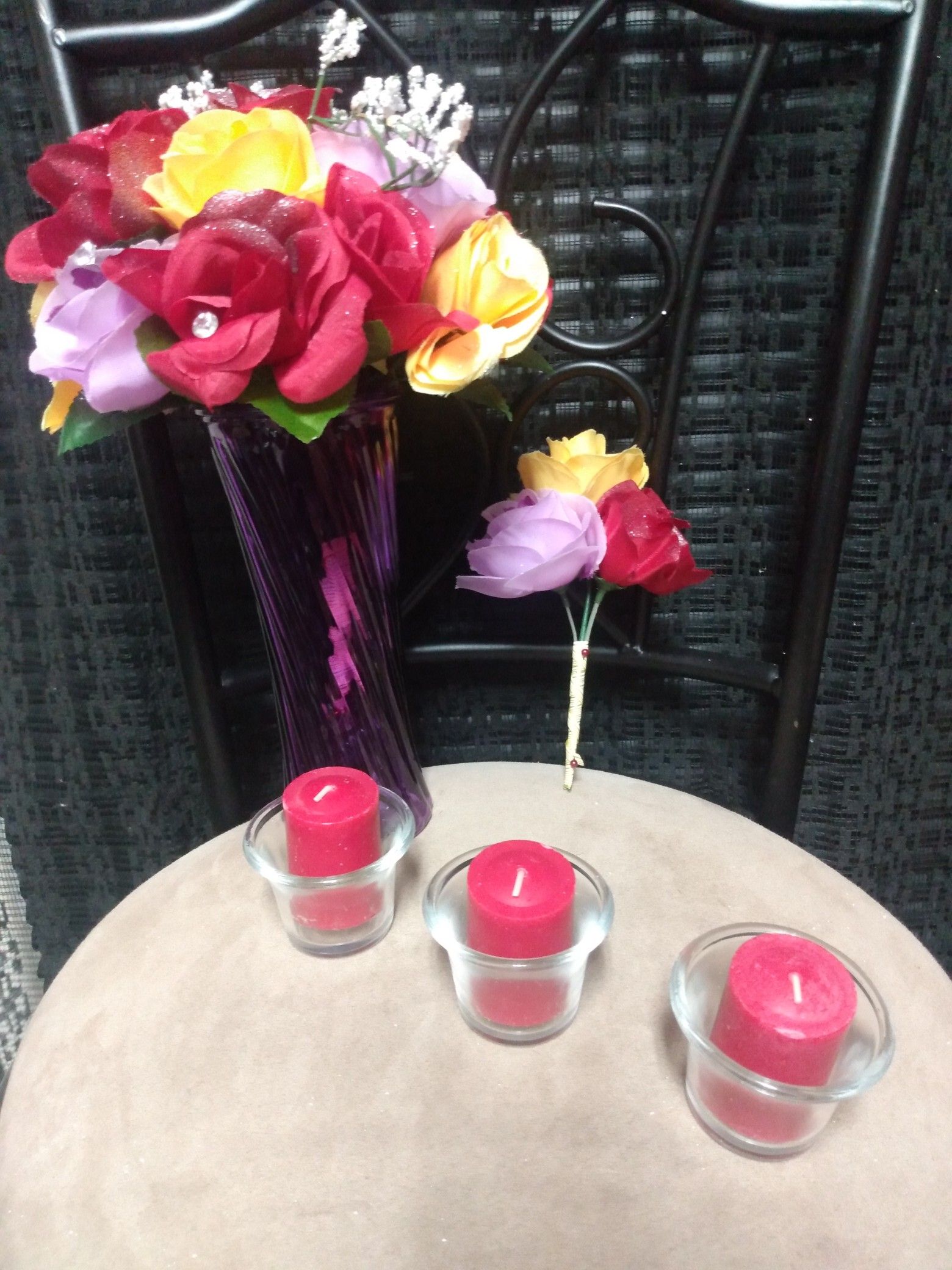 π $40 very beautiful Red/ Yellow /2 tone Purple roses in a purple vase, Includes: boutonniere, (3) red scented candles + (3) candles holders.