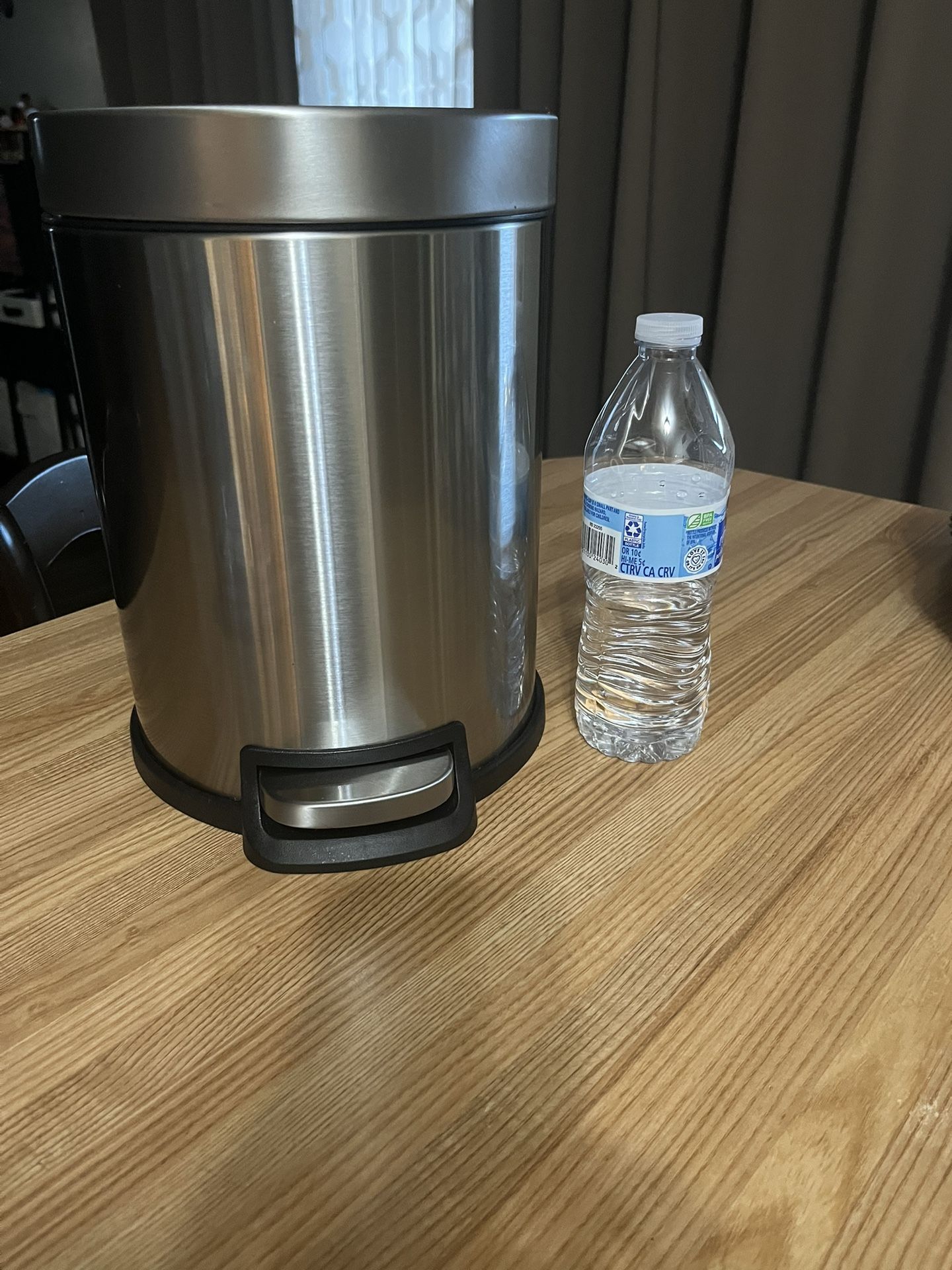 Small aluminum trash can,