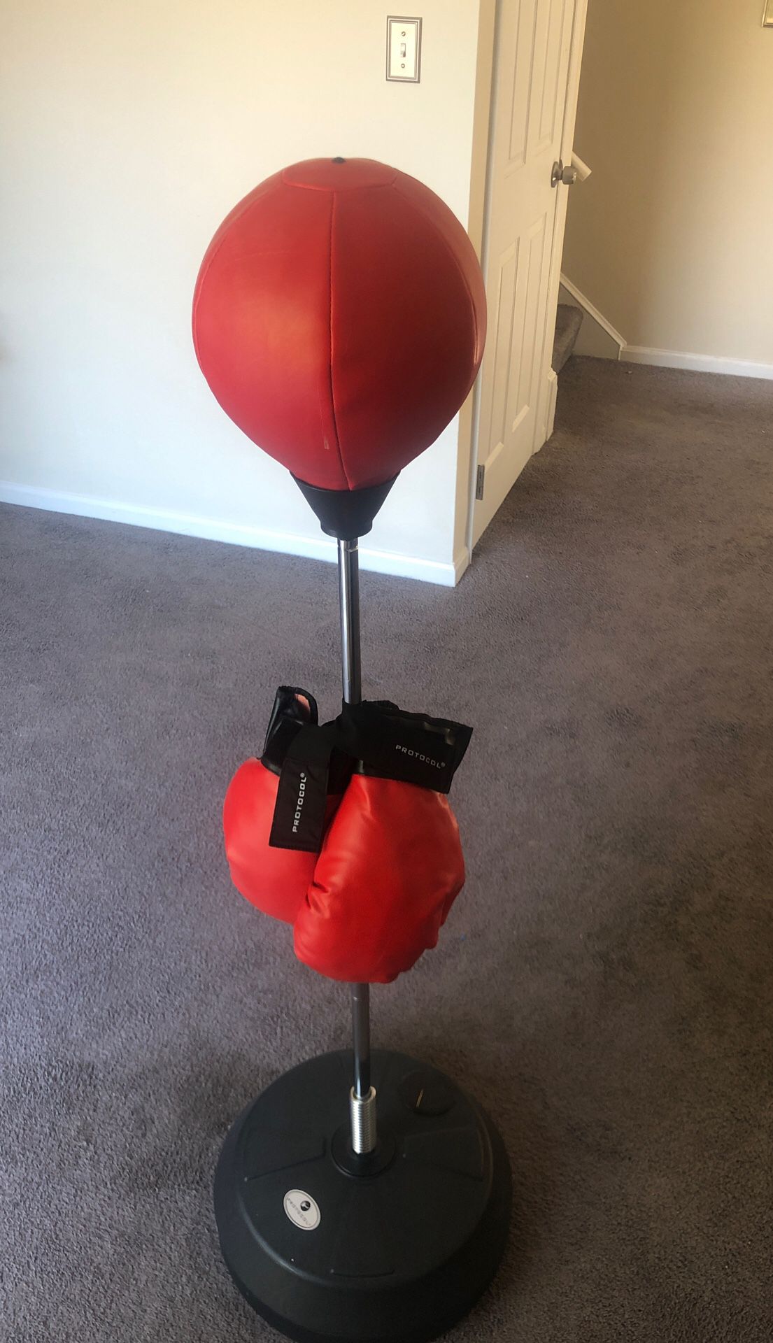 Boxing punch bag with gloves