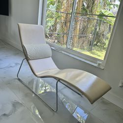 Lounge chair in chrome metal, leather covering  