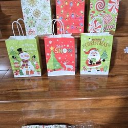 24 Pcs 5.9*3.1*8.3 Inch, Christmas Paper Gift Bags with Handles, Santa Claus Snowman Christmas Tree Gift Bags